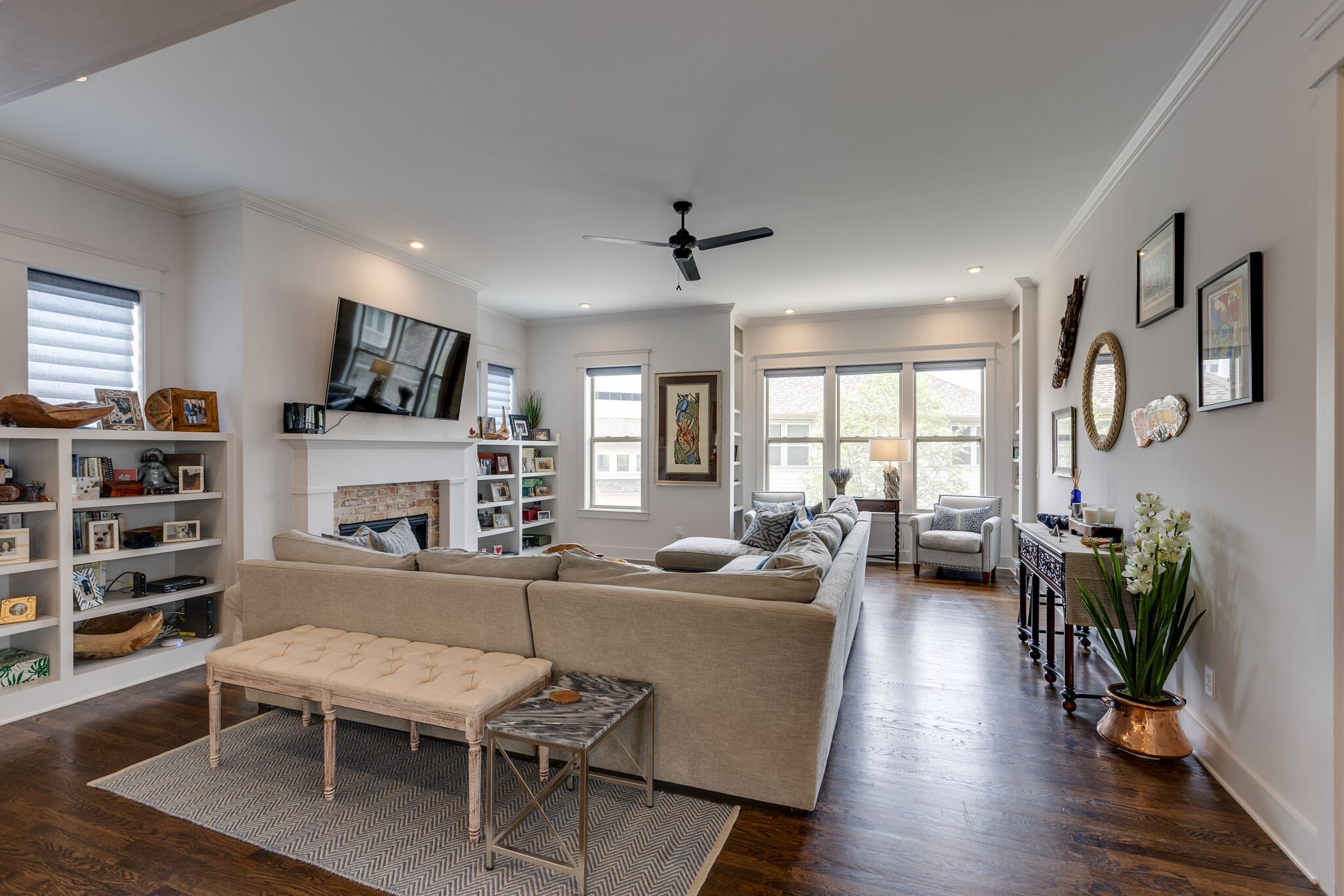 3406 Love Circle Nashville, TN 37212 - Photo 15 of 40 a living room with furniture a flat screen tv and a fireplace