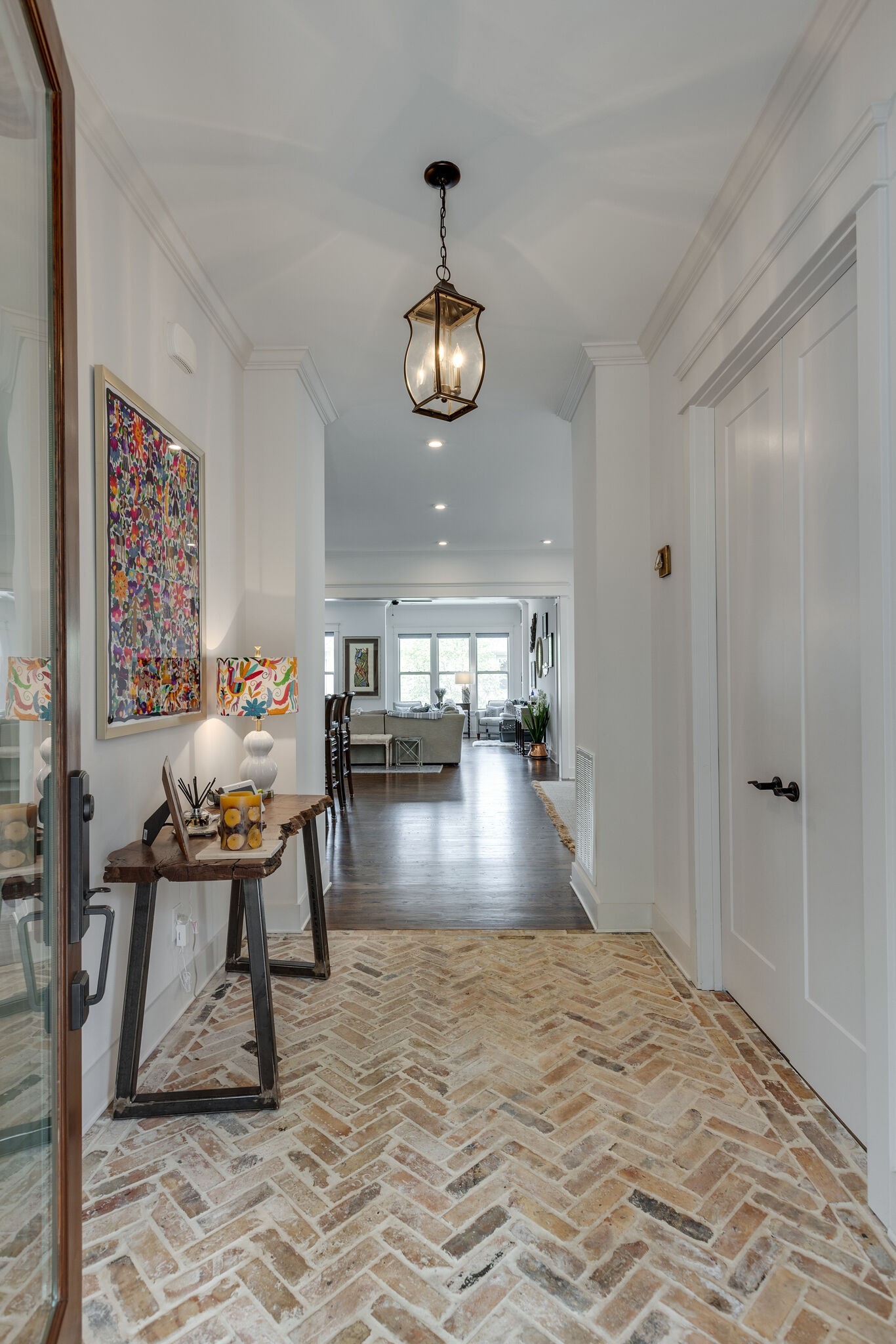3406 Love Circle Nashville, TN 37212 - Photo 5 of 40 a view of a dining room with furniture wooden floor and a chandelier