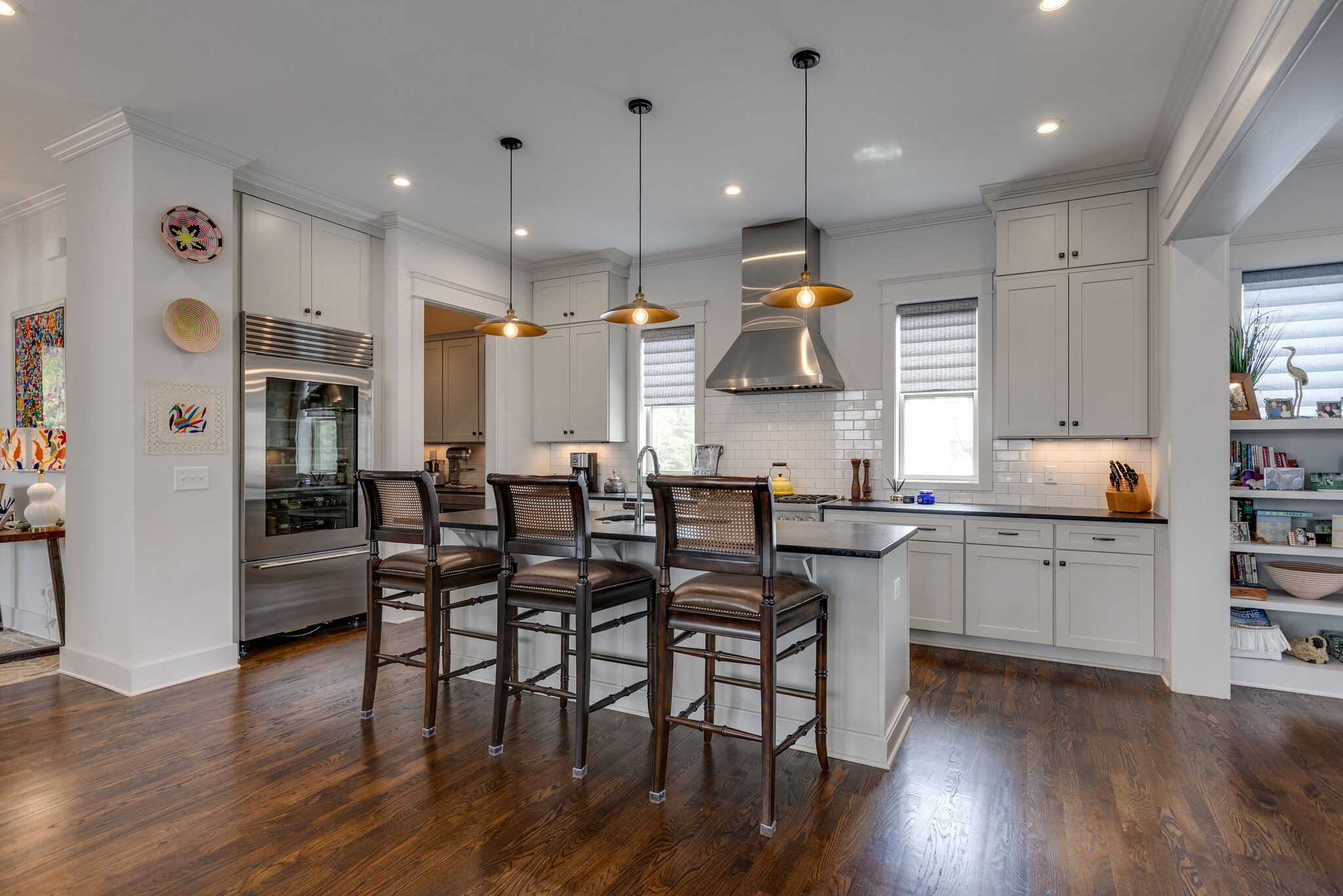 3406 Love Circle Nashville, TN 37212 - Photo 10 of 40 a kitchen with stainless steel appliances granite countertop a kitchen island hardwood floor and a sink