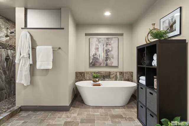 a bathroom with a bathtub and shower