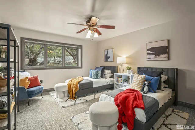 a living room with furniture a rug and a window