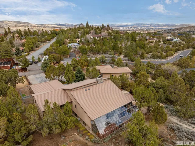 an aerial view of a house with a garden