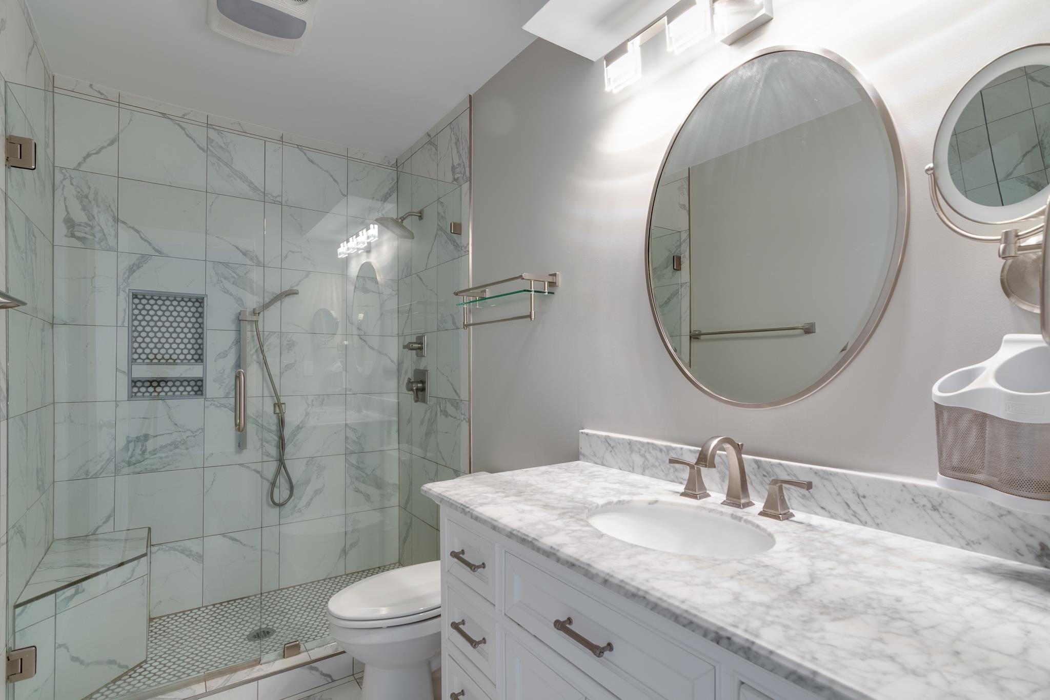 971 June Road, Unit 7 Memphis, TN 38119 - Photo 19 of 23 Full bathroom with a shower stall, marble finish floor, toilet, and vanity