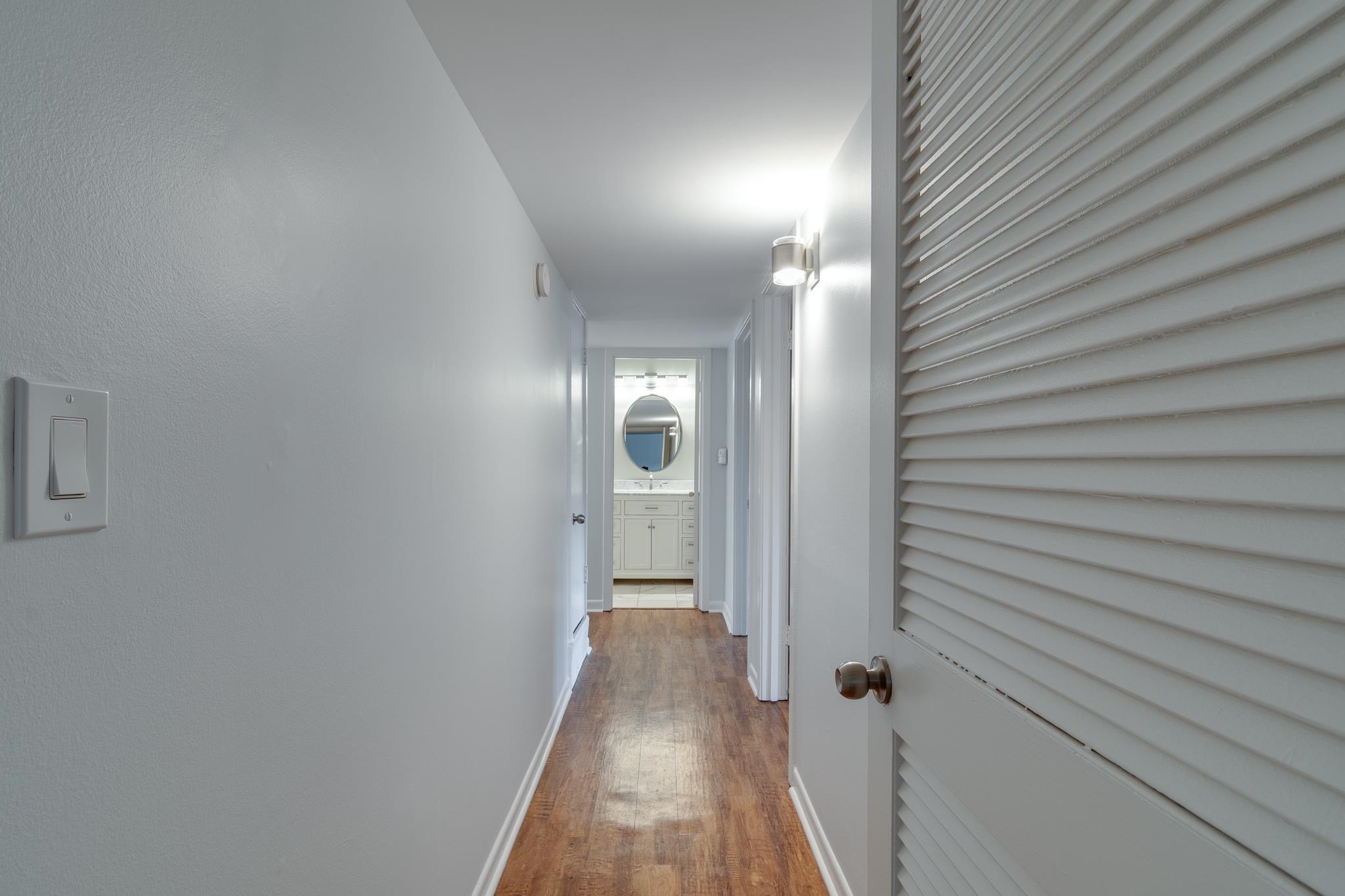 971 June Road, Unit 7 Memphis, TN 38119 - Photo 9 of 23 Hall with baseboards and wood finished floors