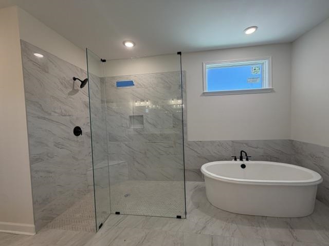 210 Drake Drive Collierville, TN 38017 - Photo 13 of 19 a white bath tub sitting next to a bathroom