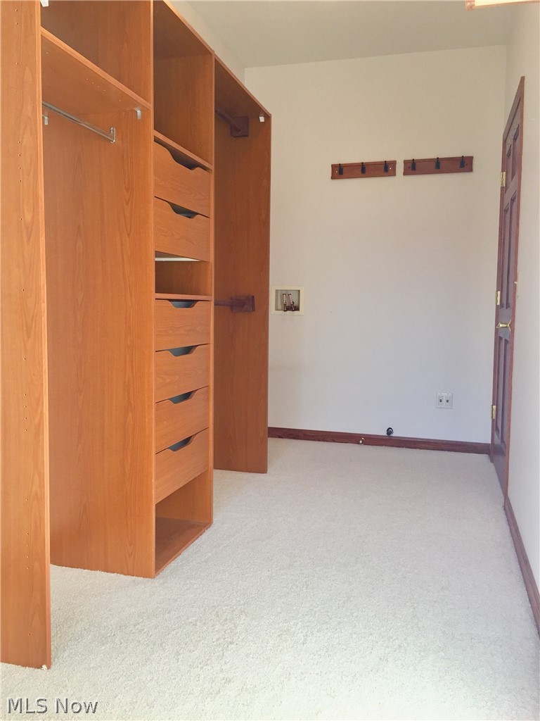 18925 Thorpe Road Chagrin Falls, OH 44023 - Photo 28 of 34 Walk in closet has built in storage system and laundry hook up — nice!