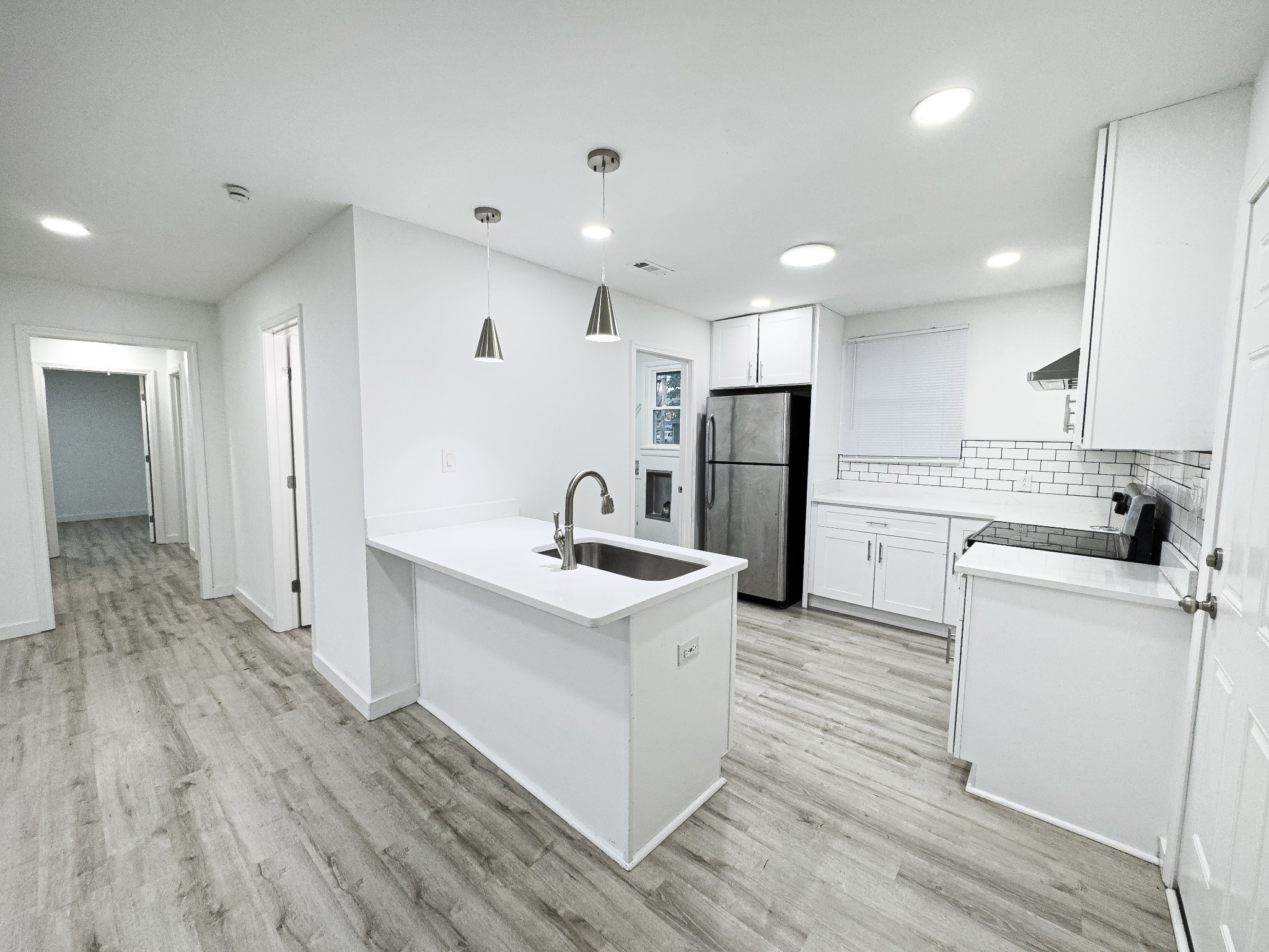 1307 Jarrett Drive Springfield, TN 37172 - Photo 4 of 20 a kitchen with white cabinets and stainless steel appliances