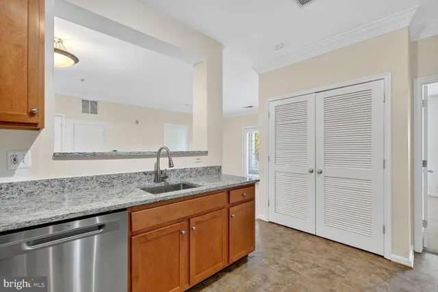 a kitchen with cabinets appliances and a counter top