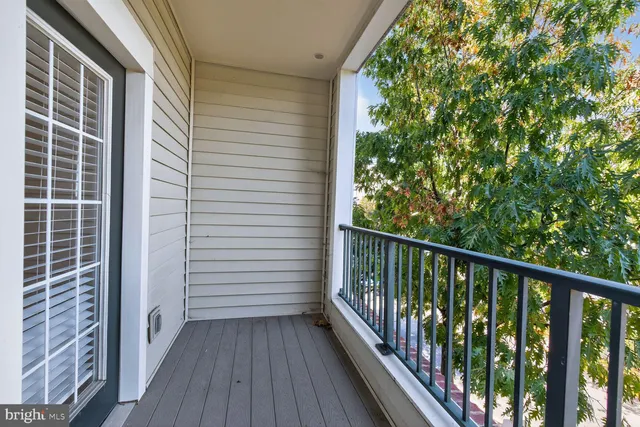 a view of balcony with wooden floor