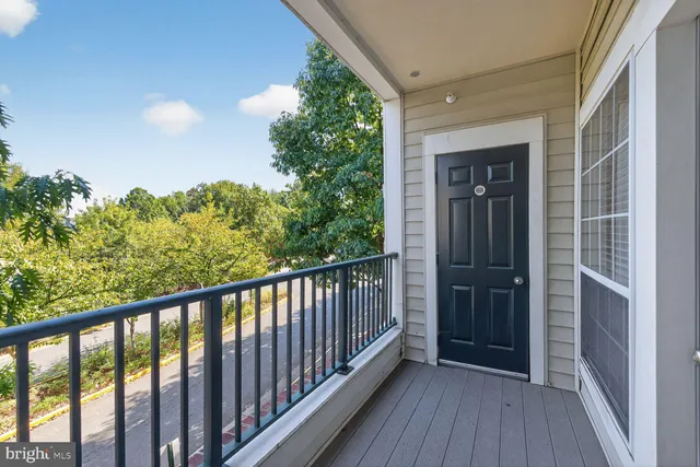 a view of balcony with wooden floor