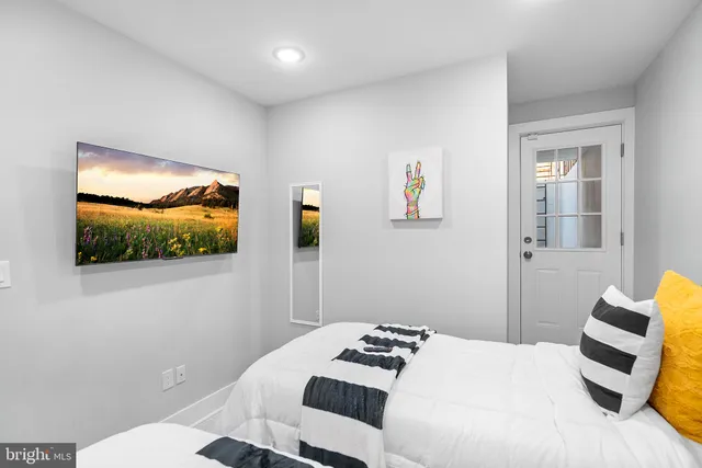 a bedroom with a bed and a closet