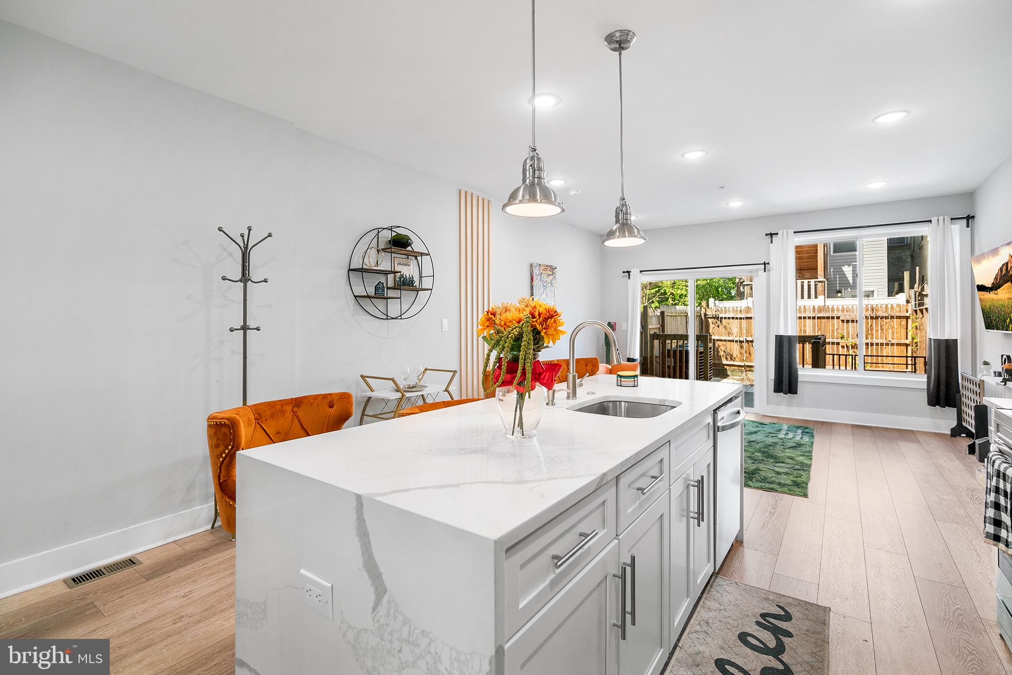 1924 North 6th Street, Unit 2 Philadelphia, PA 19122 - Photo 3 of 15 a kitchen that has a lot of white cabinets and wooden floor