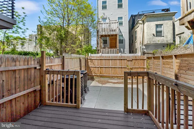 a view of a house with a door and a yard