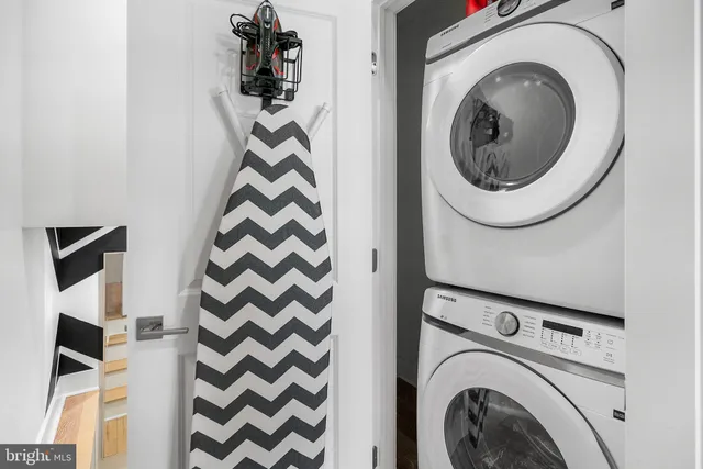 a bedroom with two beds and a window