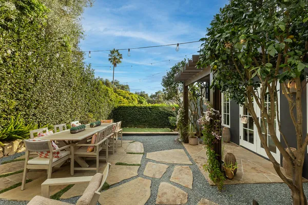 a view of a chairs and table in the patio
