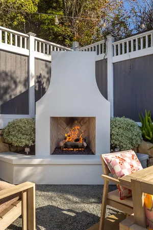 a building outdoor space with patio furniture and potted plants