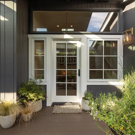 a front view of a house with a garden