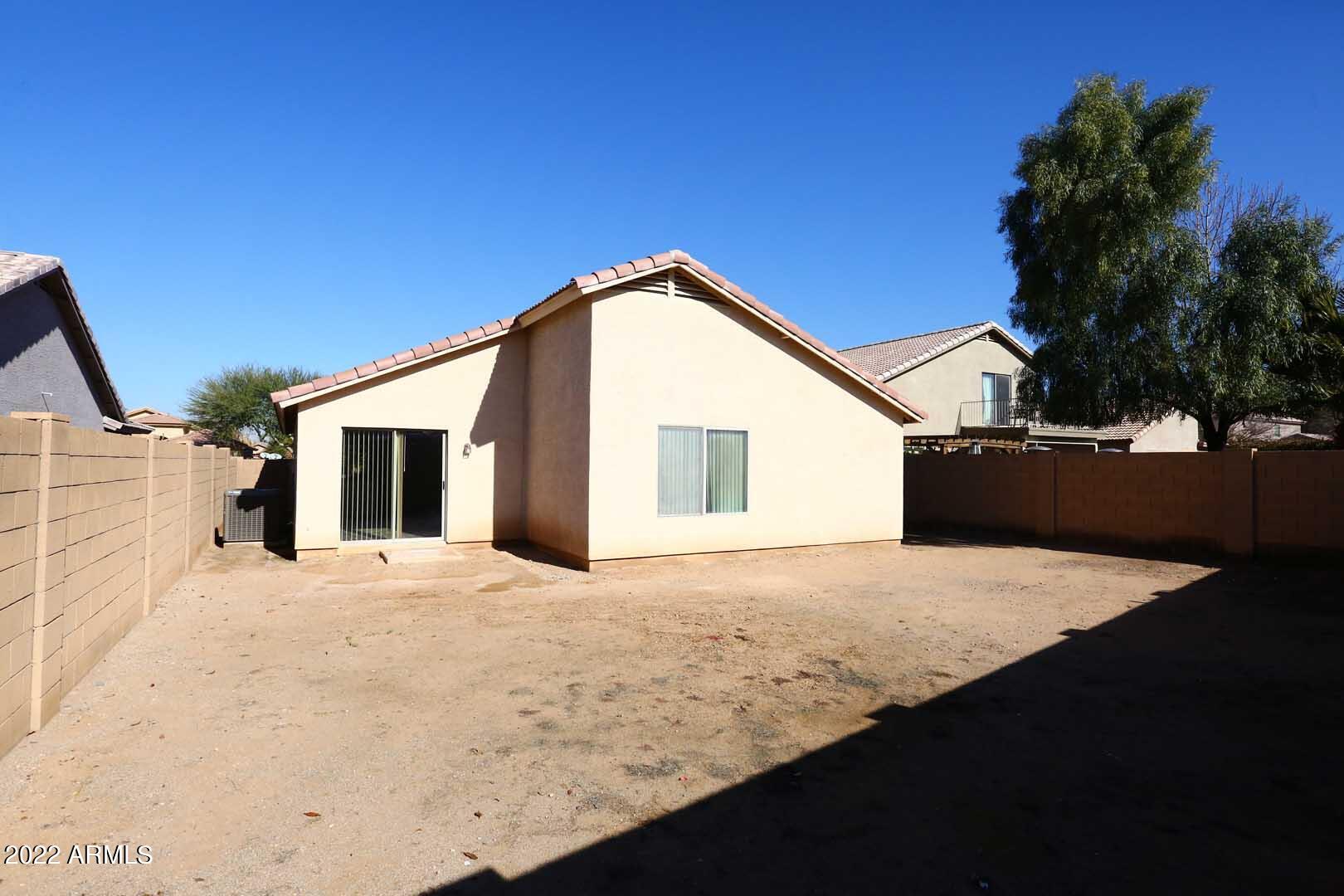 4319 West Carson Road Laveen, AZ 85339 - Photo 36 of 36 a front view of a house with a yard