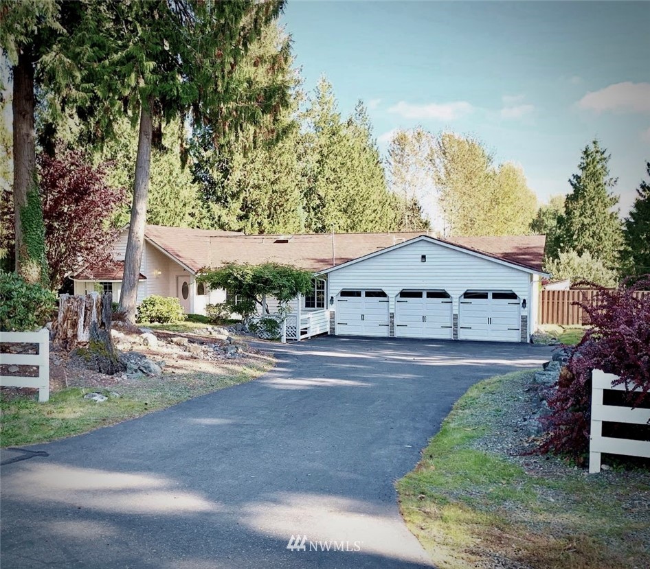 7025 Vandermark Road East Bonney Lake, WA 98391 - Photo 1 of 25 front view of a house with a street