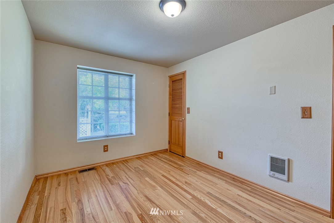 7025 Vandermark Road East Bonney Lake, WA 98391 - Photo 17 of 25 an empty room with windows