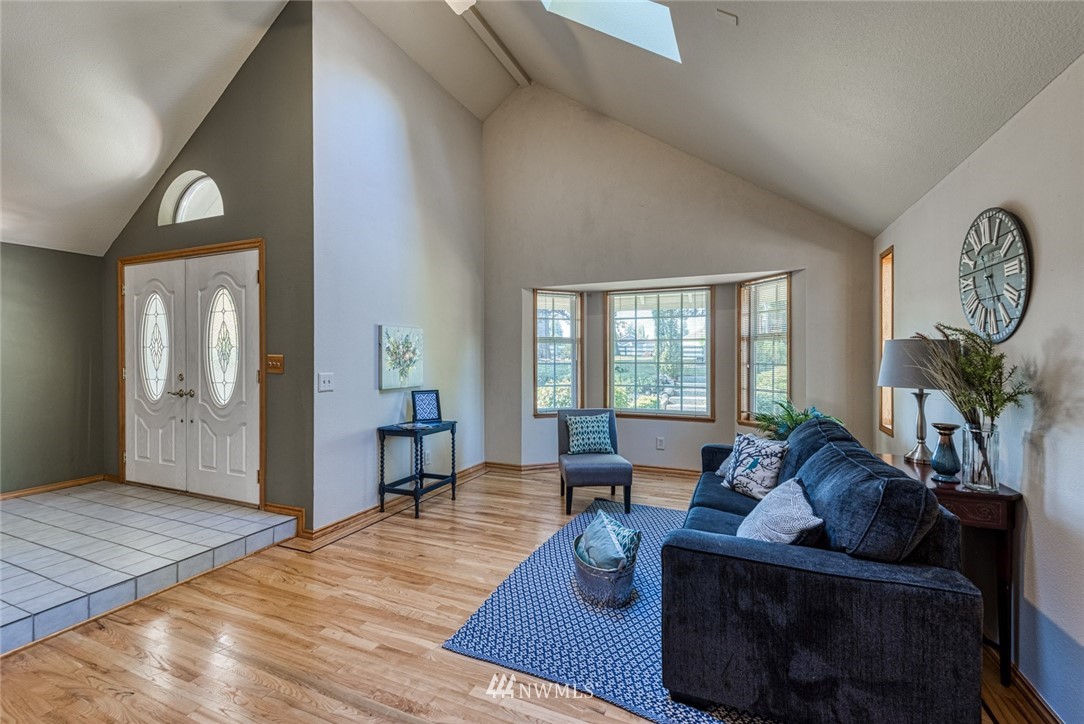 7025 Vandermark Road East Bonney Lake, WA 98391 - Photo 3 of 25 a living room with furniture and wooden floor