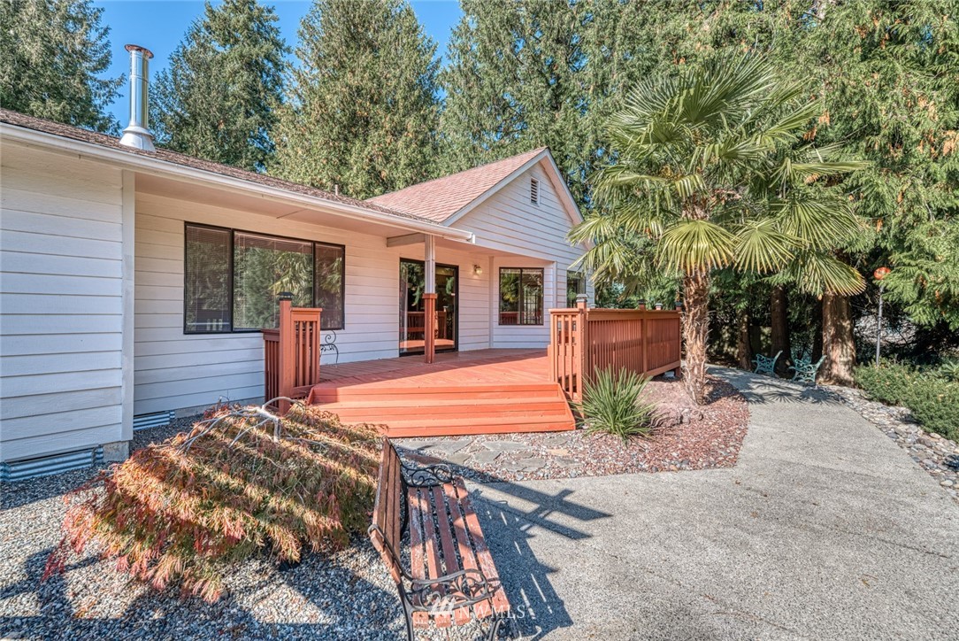 7025 Vandermark Road East Bonney Lake, WA 98391 - Photo 21 of 25 a backyard of a house with barbeque oven and outdoor seating