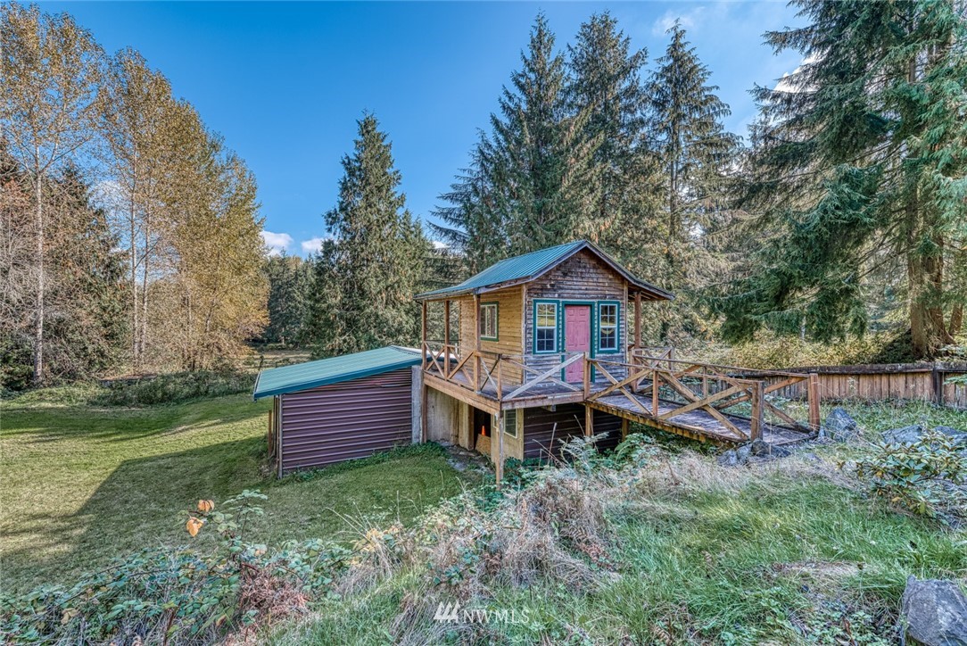 7025 Vandermark Road East Bonney Lake, WA 98391 - Photo 23 of 25 a front view of a house with garden