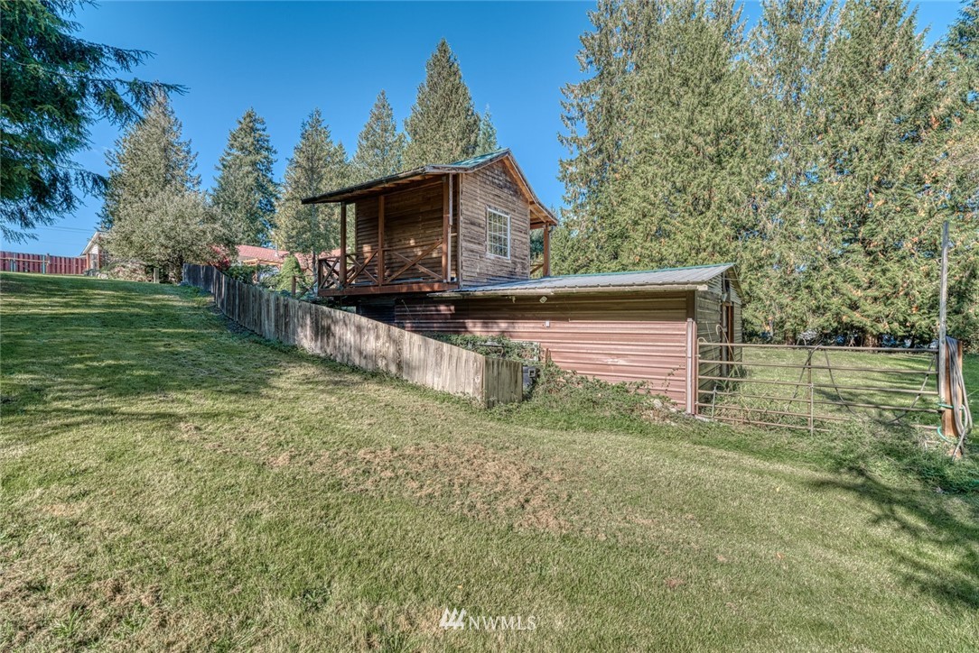 7025 Vandermark Road East Bonney Lake, WA 98391 - Photo 24 of 25 a view of house with backyard and entertaining space