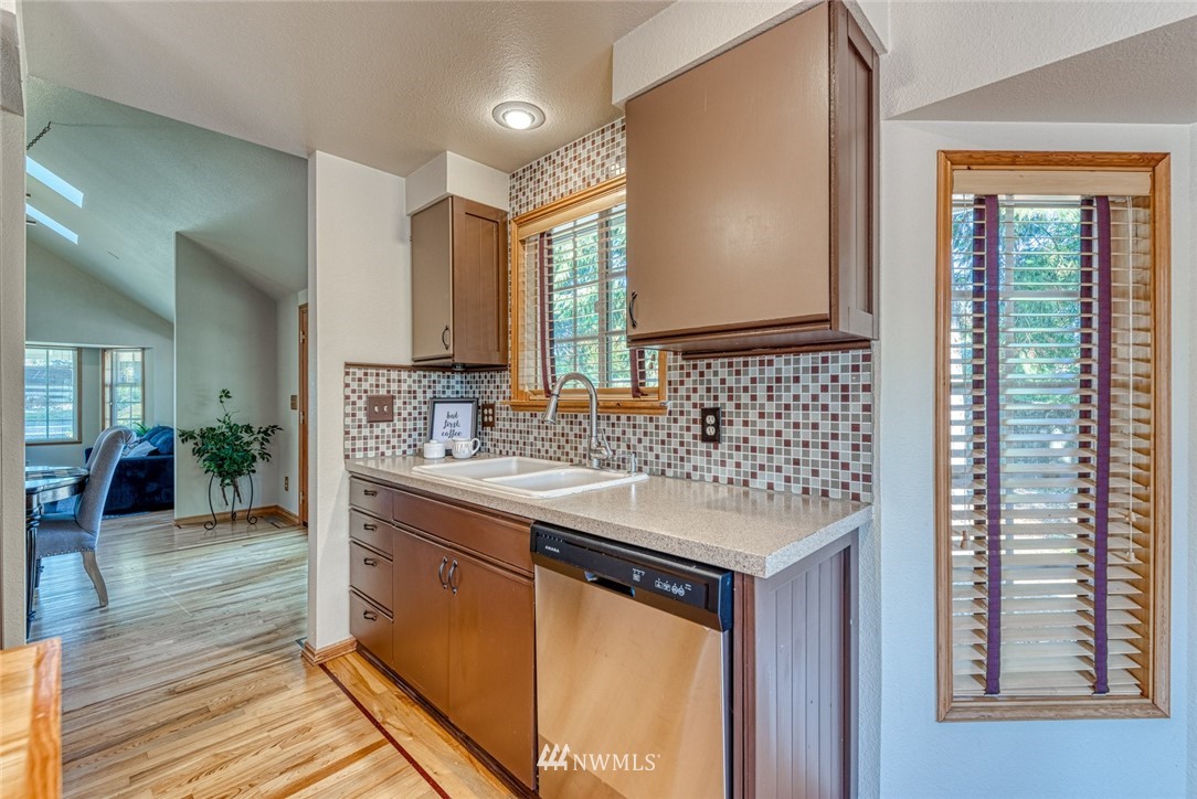 7025 Vandermark Road East Bonney Lake, WA 98391 - Photo 8 of 25 a bathroom with a sink and a mirror