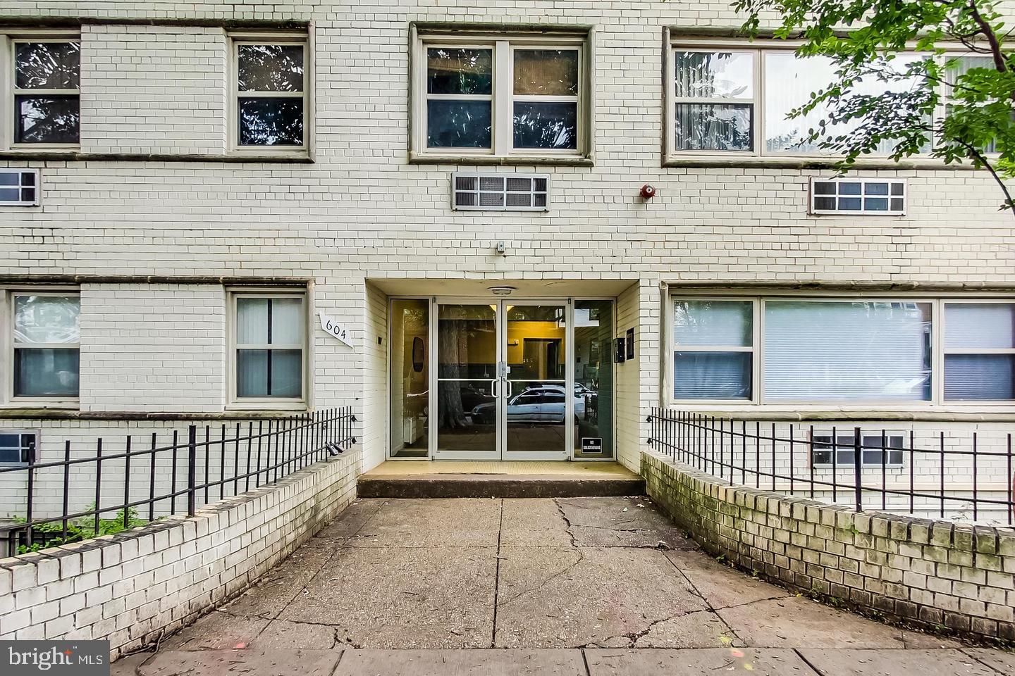 604 Longfellow Street Northwest, Unit 303 Washington, DC 20011 - Photo 2 of 12 a view of a brick house with large windows