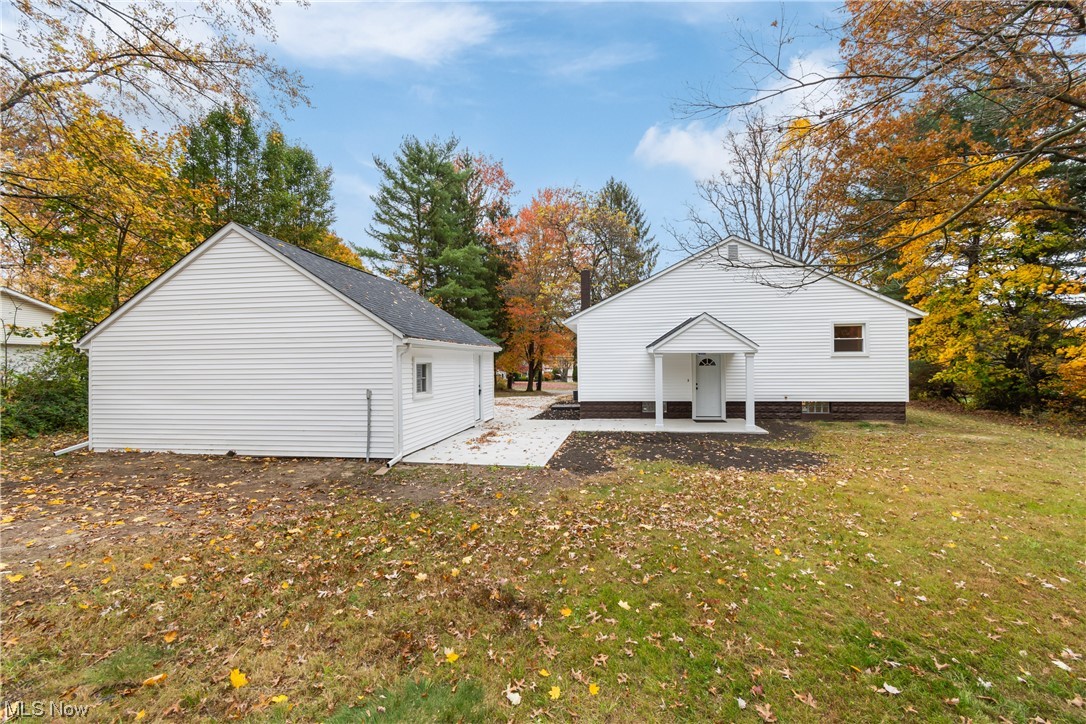 916 Renninger Road Akron, OH 44319 - Photo 26 of 31 Back of house featuring a yard and a patio