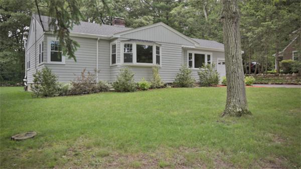 141 Ridge Street Winchester, MA 01890 - Photo 1 of 20 a front view of house with yard and green space