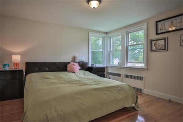 141 Ridge Street Winchester, MA 01890 - Photo 11 of 20 a bedroom with a bed and a window