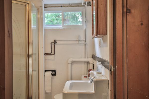 141 Ridge Street Winchester, MA 01890 - Photo 16 of 20 a bathroom with a sink a window and a shower