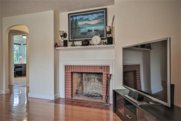 141 Ridge Street Winchester, MA 01890 - Photo 7 of 20 a living room with furniture and a fireplace