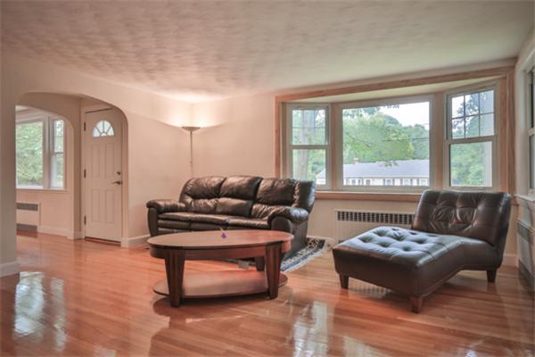 141 Ridge Street Winchester, MA 01890 - Photo 8 of 20 a living room with furniture and a window