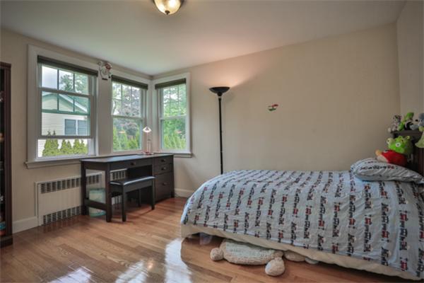141 Ridge Street Winchester, MA 01890 - Photo 10 of 20 a bedroom with a bed and a table