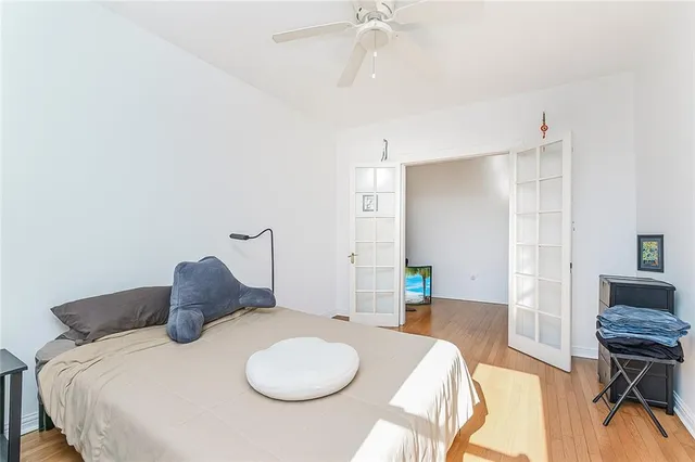 a bedroom with a bed and a table