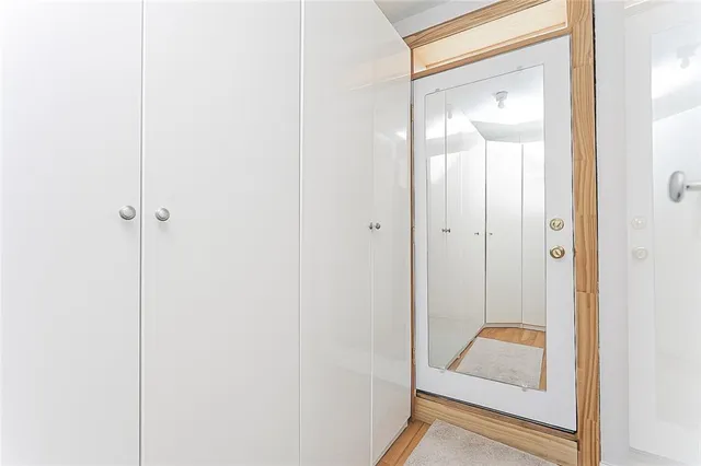 a view of a bathroom from a hallway