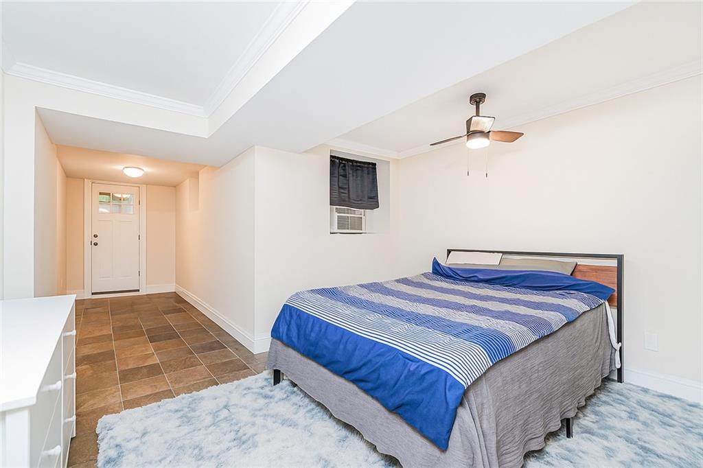 227 94th Street Brooklyn, NY 11209 - Photo 25 of 34 a bedroom with bed and window