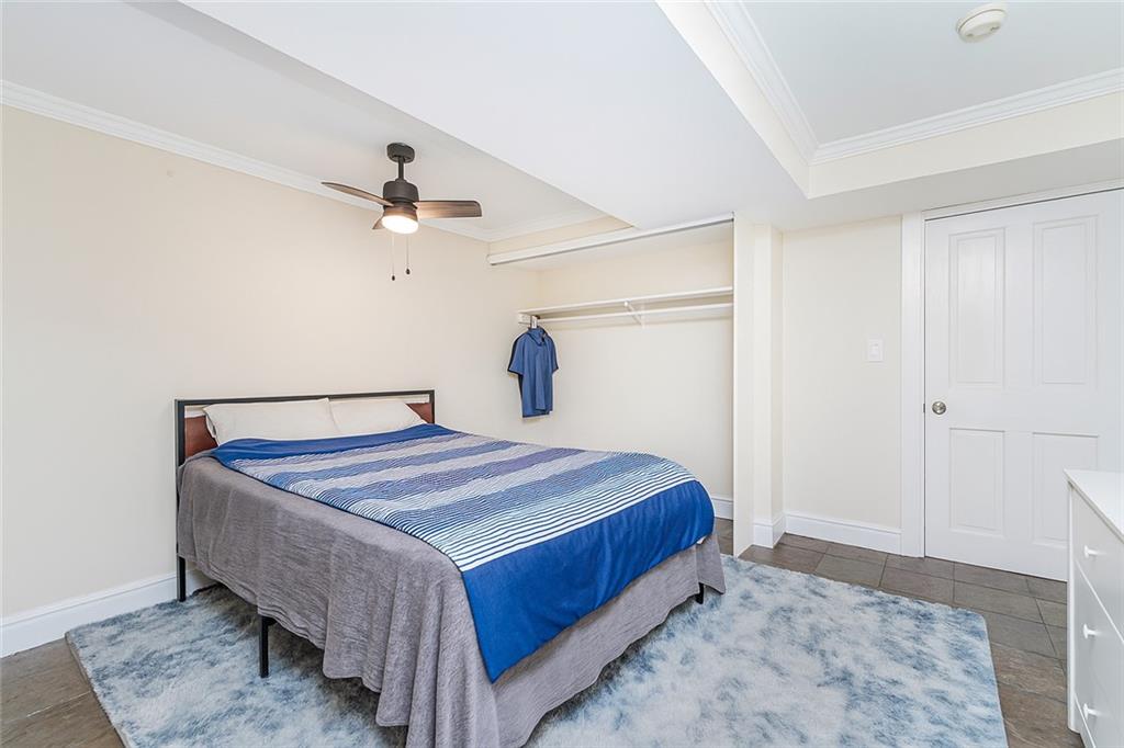 227 94th Street Brooklyn, NY 11209 - Photo 26 of 34 a bedroom with a bed and a ceiling fan