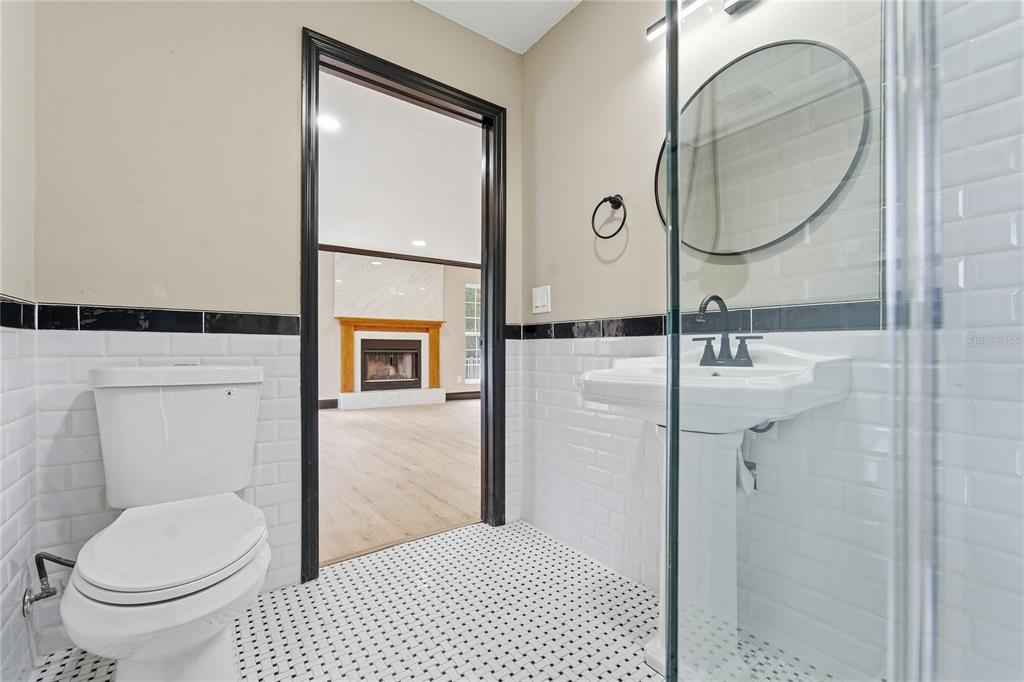 14728 Henson Road Orlando, FL 32832 - Photo 35 of 79 a bathroom with a toilet sink and mirror