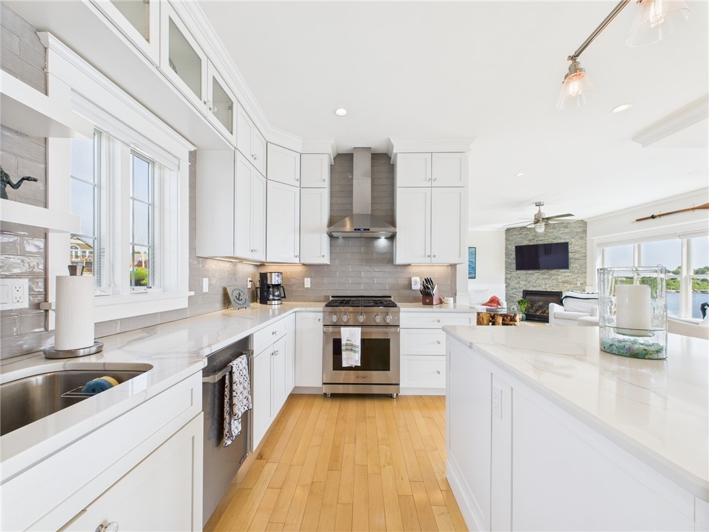 4 Clarkes Village Road Jamestown, RI 02835 - Photo 7 of 31 The elegant kitchen has cabinets to the ceiling and lots of storage