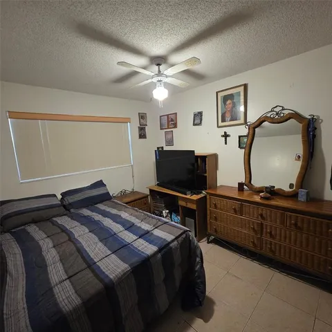 a bedroom with a bed and a closet