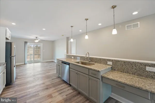 a kitchen with a sink and window