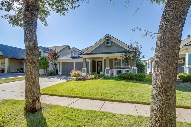 a front view of a house with swimming pool having outdoor seating