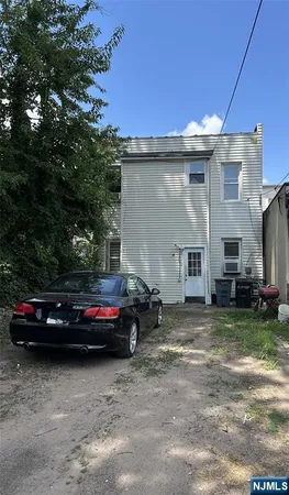 a view of a house with a back yard