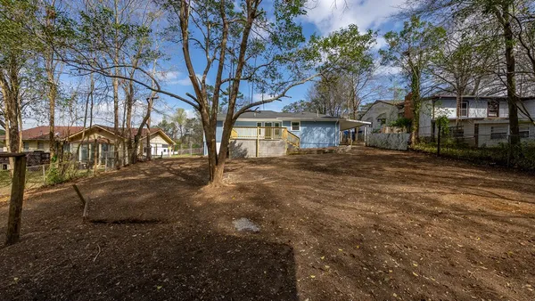 a view of outdoor space with deck and large trees