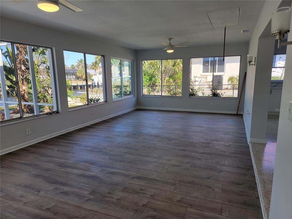 1732 Boca Raton Court Punta Gorda, FL 33950 - Photo 43 of 64 an empty room with wooden floor and windows