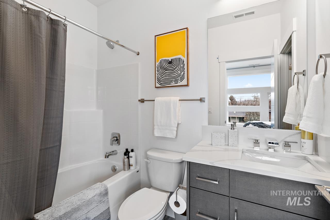 599 West Warren Street Boise, ID 83706 - Photo 41 of 41 Modern bathroom featuring a vanity with gray cabinetry, white countertop, and integrated sink